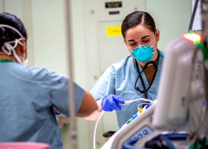 USNS Mercy Sailor Treats Patient (49785699776)