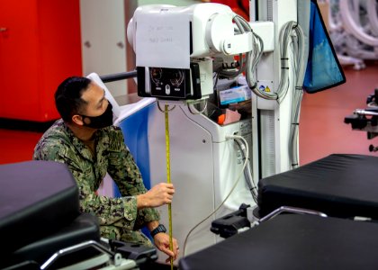 USNS Mercy Sailor Calibrates Mobile X-Ray (49827277547)