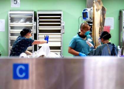 USNS Mercy Sailors Treat Patient (49758476622)