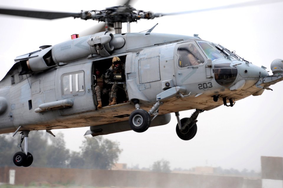 US Navy 100417-N-0879R-561 Crew members assigned to the Red Wolves of Helicopter Sea Combat Squadron (HSC) 84 and members of the U.S. Special Forces