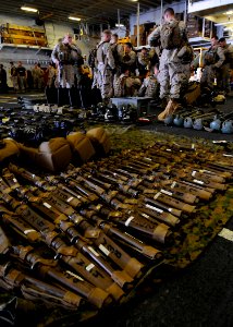 US Navy 100418-N-7948R-005 arines assigned to the 15th Marine Expeditionary Unit (15th MEU) take inventory of gear and weapons aboard the amphibious assault ship USS Peleliu (LHA 5)