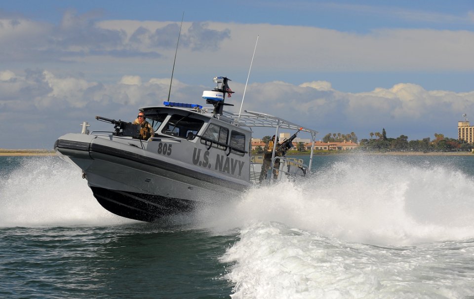 US Navy 100422-N-4965F-340 Sailors assigned to a boat detachment of Maritime Expeditionary Security Squadron (MSRON) 3 perform high-speed maneuvers during a Navy Expeditionary Combat Command Integrated Exercise