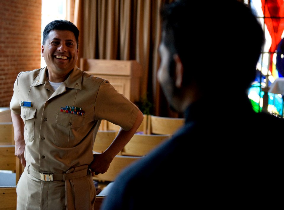 US Navy 100419-N-7090S-100 Lt. Cmdr. Abuhena M. Saifulislam, one of four Muslim chaplains in the Navy, talks to a civilian after a prayer session at Washington Navy Yard Chapel, Washington, D.C