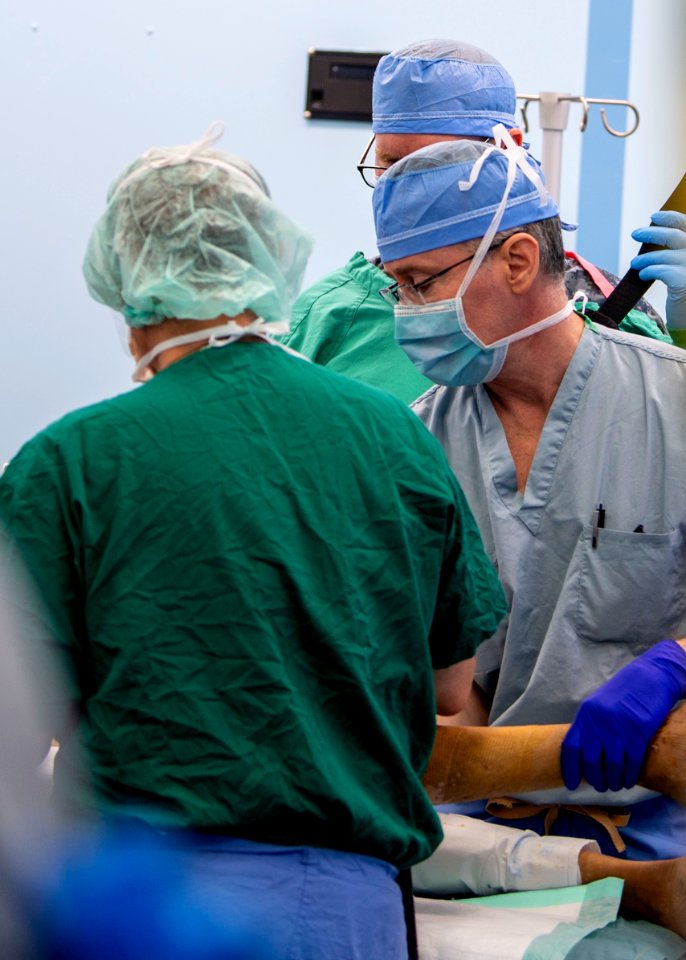 USNS Mercy Sailors Prepare Patient for Surgery (49833486553)
