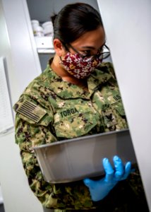 USNS Mercy Sailor Inventories Medicine (49834024716)