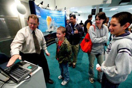 US Navy 100422-N-8863V-094 Jeff Walden demonstrates a computer game to participants during the Take A Child 2 Work Day event at Naval Surface Warfare Center, Corona Division photo