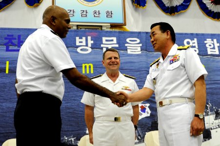 US Navy 100421-N-8959T-101 Korean navy Rear Adm. Lee Beom-Rim, right, assumes command of Combined Task Force 151 from Singapore navy Rear Adm. Bernard Miranda