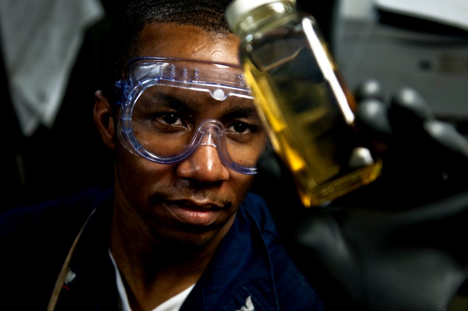 US Navy 100421-N-5712P-009 Machinist's Mate 3rd Class Dontra Brown examines boiler fuel for sediment and water