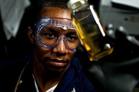 US Navy 100421-N-5712P-009 Machinist's Mate 3rd Class Dontra Brown examines boiler fuel for sediment and water