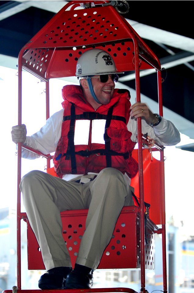 US Navy 100421-N-6935K-012 Capt. Ted Williams, executive officer of the aircraft carrier USS Dwight D. Eisenhower (CVN 69), rides a transfer chair back from the Military Sealift Command fast combat support ship USNS Supply (T-A