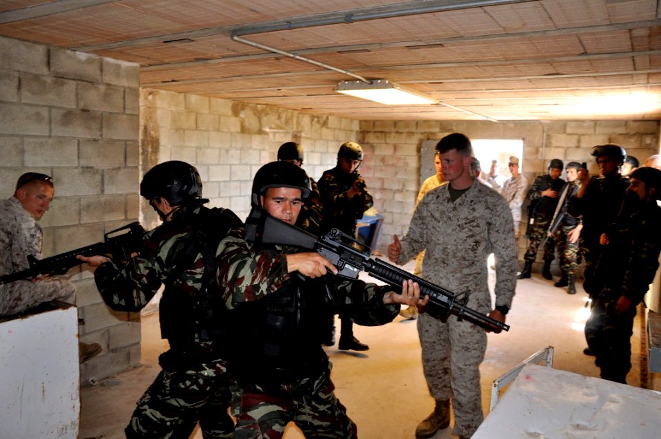 US Navy 100427-N-3289C-272 Lance Cpl. Drew Van Hook instructs a Moroccan maritime interdiction operations team on basic close quarter battle training