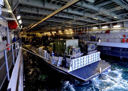 US Navy 100428-N-2147L-002 Landing Craft Utility (LCU) 1661 prepares to depart the well deck of USS New York (LPD 21)
