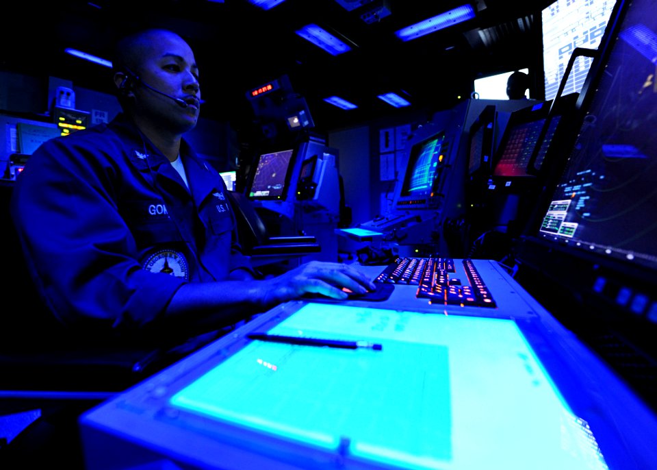 US Navy 100422-N-3885H-020 Air Traffic Controller 2nd Class Bruce Gomez stands watch in the Carrier Air Traffic Control Center aboard the aircraft carrier USS George H.W. Bush (CVN 77)