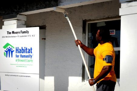 US Navy 100428-N-1522S-003 Chief Gas Turbine System Technician Gregory Reynolds paints at a Habitat for Humanity site as part of Fleet Week Port Everglades