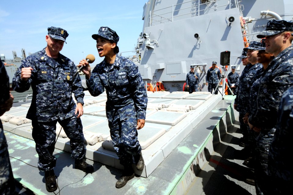 US Navy 100422-N-9818V-336 Master Chief Petty Officer of the Navy (MCPON) Rick West, left, and Gunner's Mate 2nd Class Robin Bergeron lead the crew of the guided-missile destroyer USS James E. Williams (DDG 95) in an