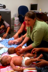 US Navy 100423-N-0641S-143 Mara MacDonald demonstrates different massage techniques to a group of new mothers and their babies in an infant massage class