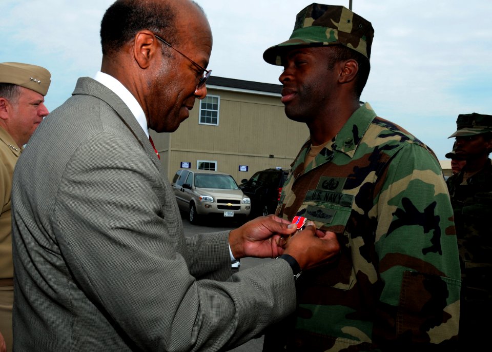 US Navy 100423-N-4267W-083 Dr. Clifford L. Stanley, Under Secretary of Defense for Personnel and Readiness, awards the Bronze Star medal to Explosive Ordnance Disposal Technician 1st Class Dewayne Cheatham
