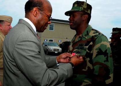 US Navy 100423-N-4267W-083 Dr. Clifford L. Stanley, Under Secretary of Defense for Personnel and Readiness, awards the Bronze Star medal to Explosive Ordnance Disposal Technician 1st Class Dewayne Cheatham