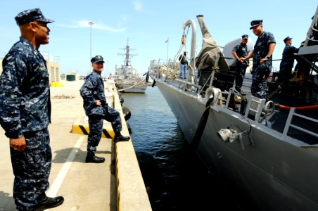 US Navy 100422-N-9818V-444 Master Chief Petty Officer of the Navy (MCPON) Rick West, right, and Force Master Chief James Williams talk with Sailors aboard the guided-missile destroyer USS Stout (DDG 55)