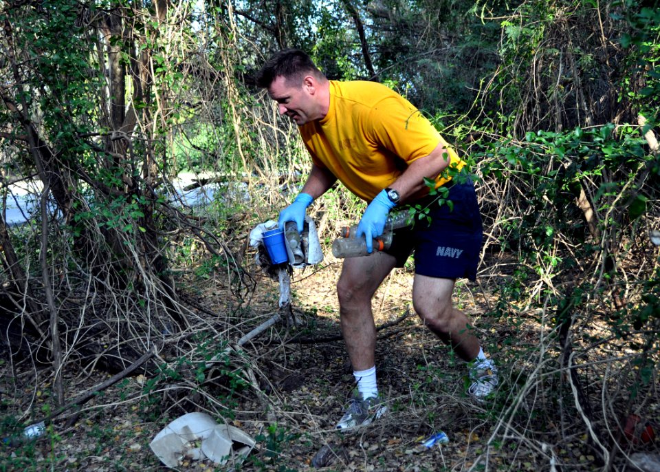 US Navy 100423-N-8241M-019 Electronics Technician 1st Michael Schiltz picks up liter during a base-wide clean-up event supporting the 40th anniversary of Earth Day at Naval Station Guantanamo Bay, Cuba