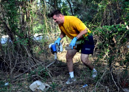 US Navy 100423-N-8241M-019 Electronics Technician 1st Michael Schiltz picks up liter during a base-wide clean-up event supporting the 40th anniversary of Earth Day at Naval Station Guantanamo Bay, Cuba