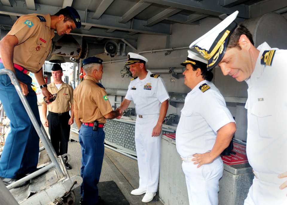 US Navy 100423-N-9301W-088 Cmdr. Scott Smith, commanding officer of the guided-missile frigate USS Klakring (FFG 42), welcomes Brazilian military and port authorities in Fortaleza, Brazil to a luncheon aboard the ship