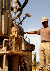 US Navy 100427-N-8816D-101 Equipment Operator 1st Class Jose Martinez, assigned to the water well detachment of Naval Mobile Construction Battalion (NMCB) 133