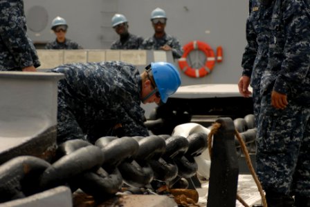 US Navy 100426-N-3358S-014 Sailors aboard the amphibious transport dock ship USS Mesa Verde (LPD 19) secure the anchor chain after a brief stop before arriving pier side in Bahrain for a port visit