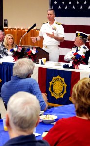 US Navy 100426-N-5208T-003 Rear Adm. Michael E. McLaughlin, commander of Submarine Group (SUBGRU) 2, speaks with members of the American Legion about the future of the submarine force during Kansas City Navy Week