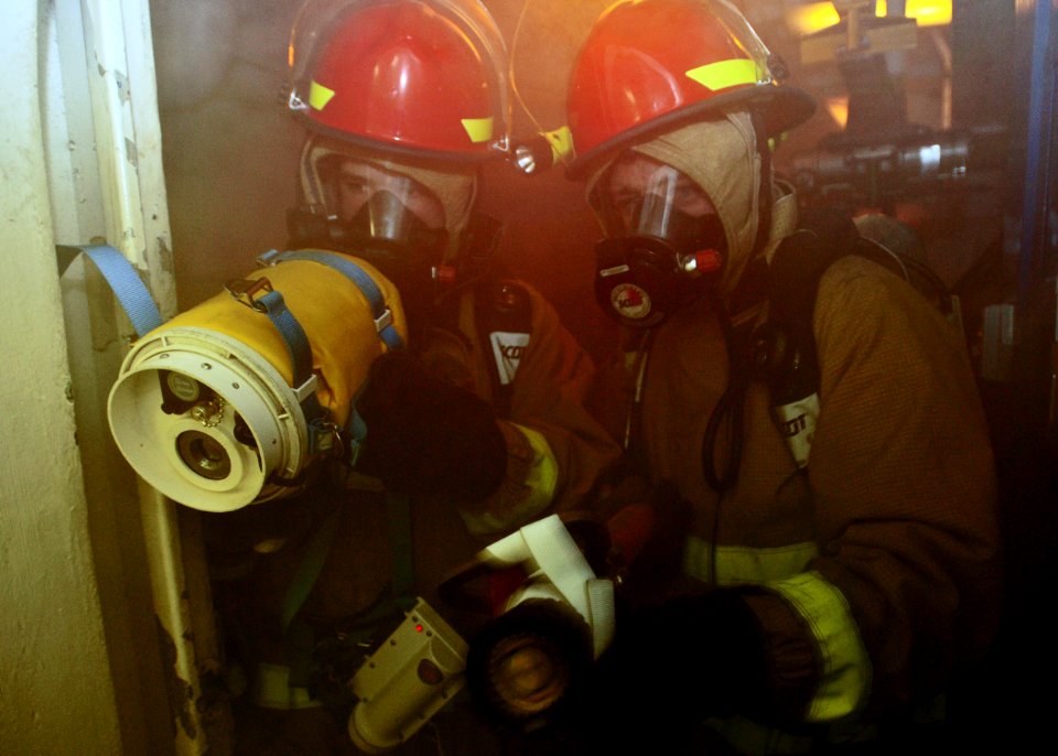 US Navy 100425-N-4516G-061 Sailors fight a simulated fire during a general quarters drill aboard the nuclear-powered aircraft carrier USS Enterprise (CVN 65)