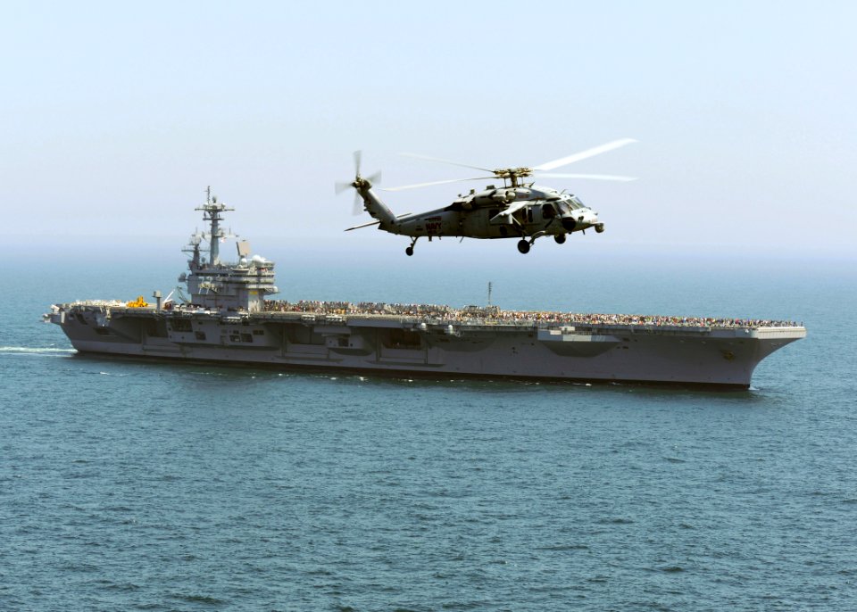 US Navy 100501-N-8913A-216 An MH-60S Sea Hawk helicopter flies around USS George H.W. Bush (CVN 77)