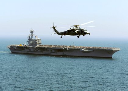 US Navy 100501-N-8913A-216 An MH-60S Sea Hawk helicopter flies around USS George H.W. Bush (CVN 77)