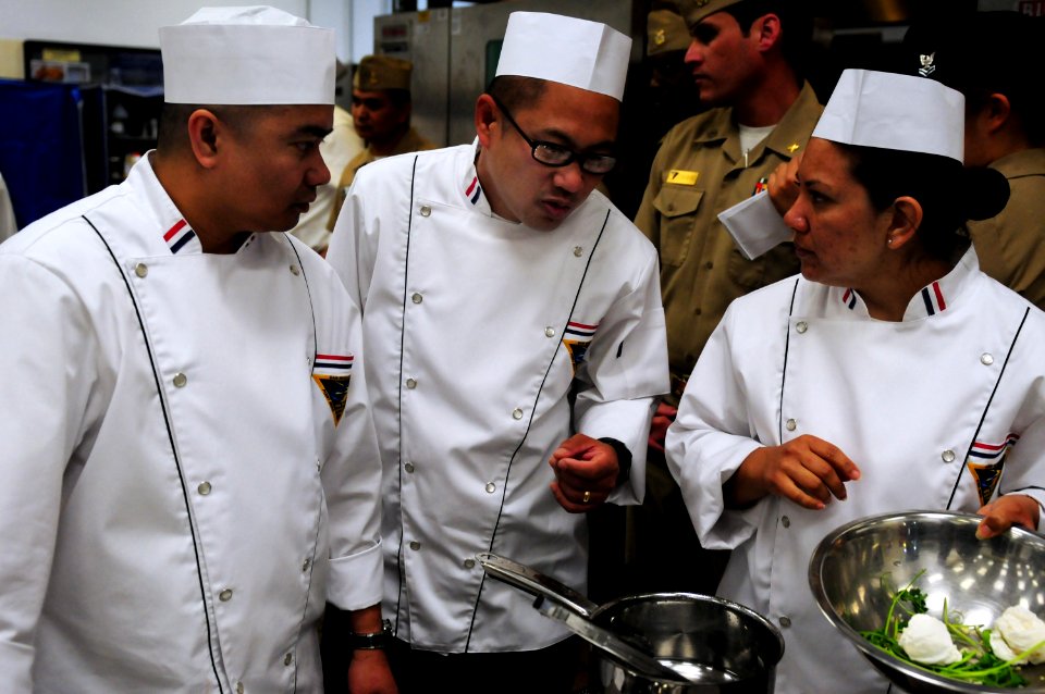 US Navy 100427-N-3659B-204 Members of the team representing Naval Base Ventura County discuss their plans for dish preparation during the 2010 Navy Region Southwest Culinary Competition