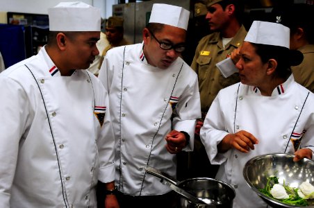 US Navy 100427-N-3659B-204 Members of the team representing Naval Base Ventura County discuss their plans for dish preparation during the 2010 Navy Region Southwest Culinary Competition photo