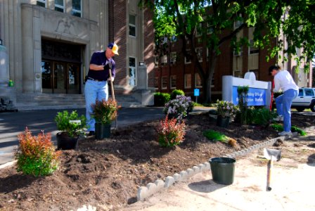 US Navy 100430-N-3154P-013 Capt. Kelly M. Johnson, commanding officer of Naval Station Norfolk, and Capt. Mary M. Jackson, executive officer of Naval Station Norfolk, plant flowers and bushes as part of clean the station day at