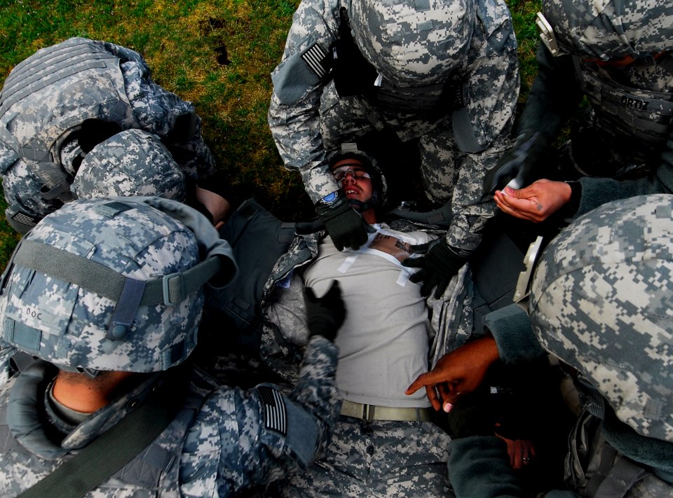 US Navy 100428-N-6538W-033 Sailors simulate treating an open chest wound on Hospital Corpsman 2nd Class Nathan Brindley