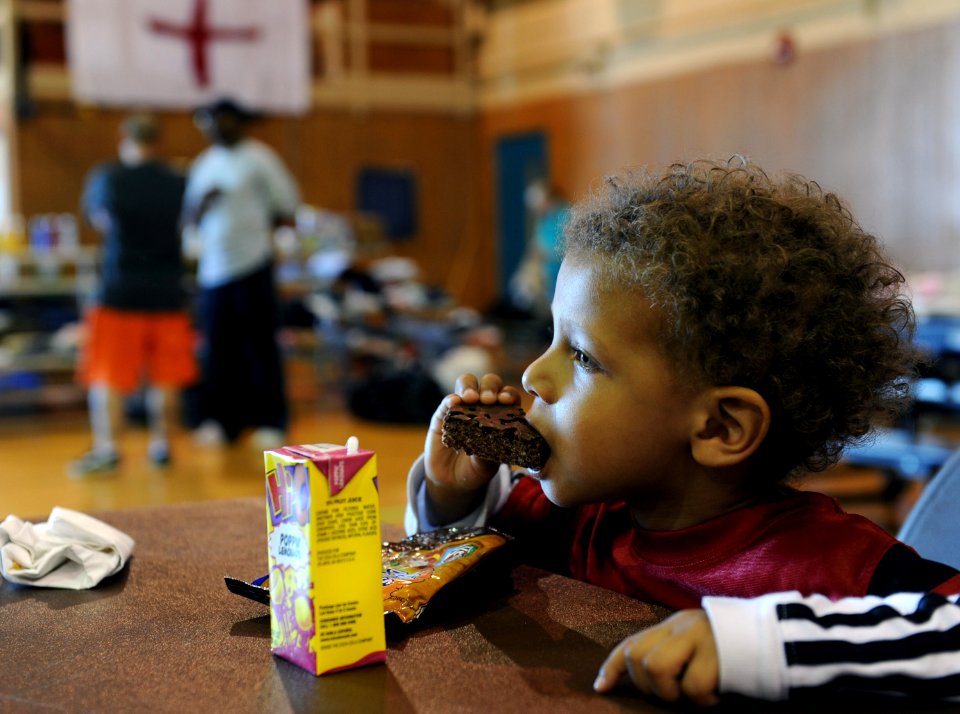 US Navy 100503-N-5862D-027 A Navy dependent eats a snack at the North-side gym at Naval Support Activity Mid-South in Millington, Tenn