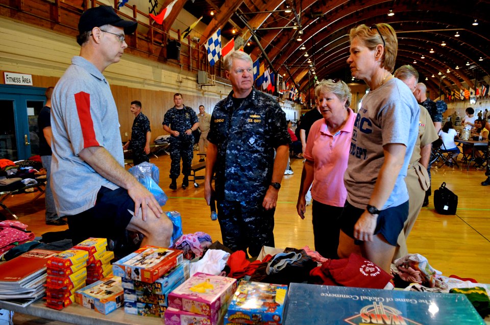 US Navy 100503-N-8273J-118 Chief of Naval Operations (CNO) Adm. Gary Roughead, center left, and his wife Ellen, speak with Fleet and Family Support Center (FFSC) personnel