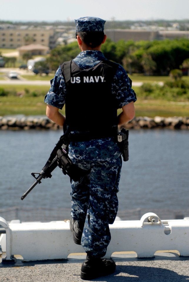 US Navy 100503-N-3154P-030 Aviation Boatswain's Mate Airman Junelle Santonia stands watch on the flight deck of the multipurpose amphibious assault ship USS Wasp (LHD 1)
