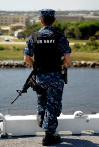 US Navy 100503-N-3154P-030 Aviation Boatswain's Mate Airman Junelle Santonia stands watch on the flight deck of the multipurpose amphibious assault ship USS Wasp (LHD 1) photo