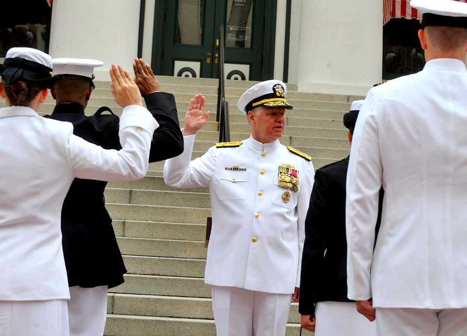 US Navy 100430-N-8273J-104 Adm. Gary Roughead administers the oath of office to 10 newly commissioned Navy and Marine Corps officers during the Naval Reserve Officers Training Corps commissioning ceremony at Florida A^M Univers