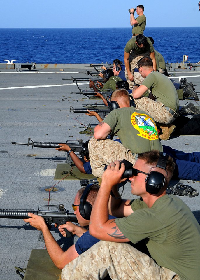 US Navy 100504-N-1082Z-032 Marines assigned to the 24th Marine Expeditionary Unit (24th MEU) watch the downrange targets during an M16 service rifle live-fire training exercise