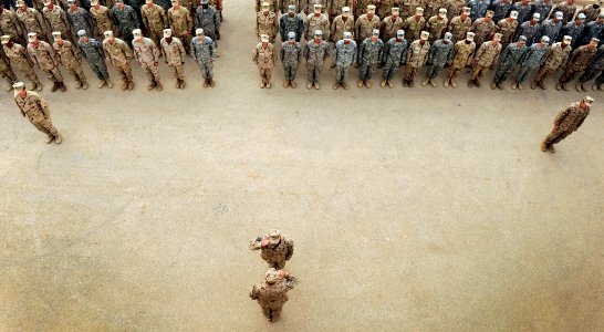 US Navy 100430-N-7130B-031 Service members assigned to Special Operations Task Force West stand in formation during a memorial marking the anniversary of the death of Explosive Ordnance Disposal Technician 2nd Class Tyler Traha photo