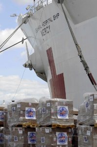 US Navy 100429-N-6410J-094 Pallets from Project Handclasp are positioned near USNS Mercy (T-AH 19) before being loaded onto the ship to support of Pacific Partnership 2010