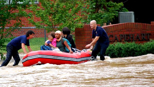 US Navy 100501-N-9999X-002 Fire rescue personnel evacuate family members from base housing at Naval Support Activity Mid-South