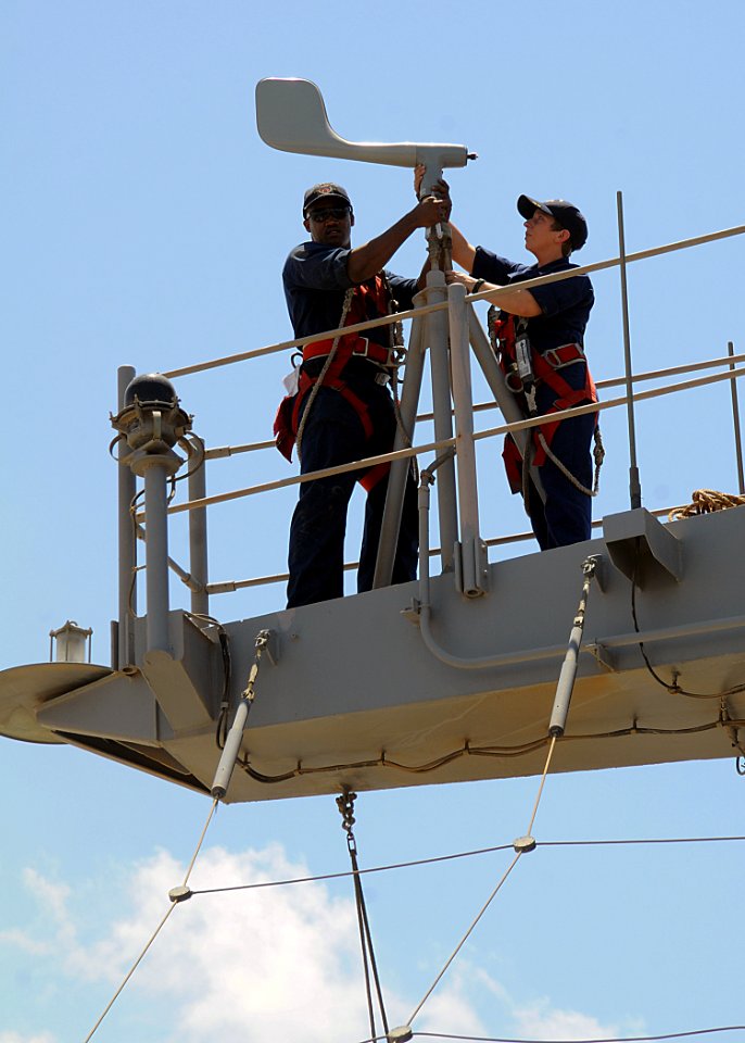 US Navy 100501-N-1082Z-077 Interior Communications Electrician 3rd Class Demetrius Wharton, from Greenwood, S.C., and Aviation Electrician's Mate 3rd Class Autumn D. Brewer