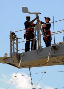 US Navy 100501-N-1082Z-077 Interior Communications Electrician 3rd Class Demetrius Wharton, from Greenwood, S.C., and Aviation Electrician's Mate 3rd Class Autumn D. Brewer
