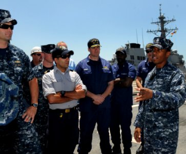 US Navy 100503-N-2259P-027 Hospital Corpsman 1st Class Marc Vidale briefs visitors about the littoral combat ship USS Freedom (LCS 1) photo
