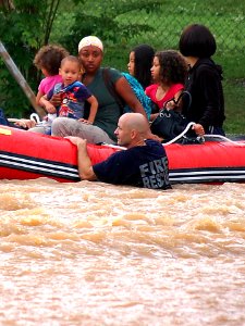 US Navy 100501-N-9999X-001 Fire rescue personnel evacuate family members from base housing at Naval Support Activity Mid-South