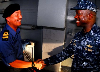 US Navy 100506-N-0995C-547 Capt. Richard L. Clemmons greets Lt. Col. Othman